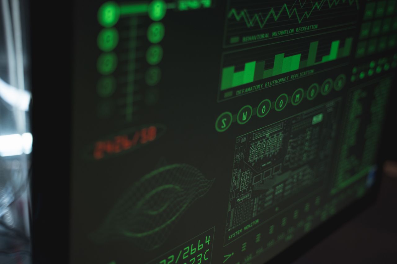 hero-img Close-up view of a computer displaying cybersecurity and data protection interfaces in green tones.
